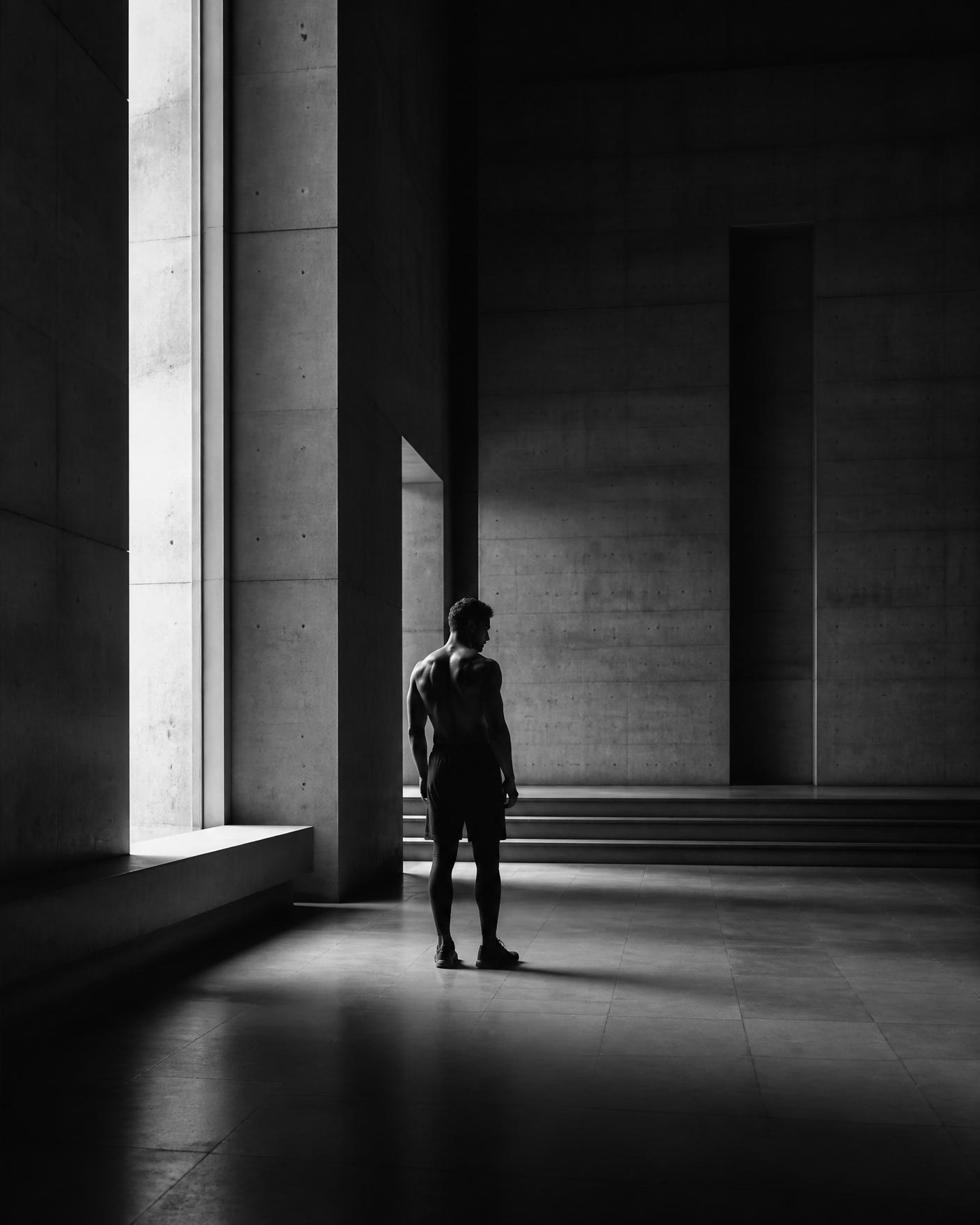 A disciplined figure in an architectural training space